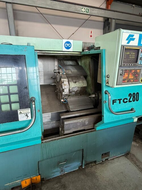 WhatsApp Image 2026-04-14 at 16.52.43 (1) FEELER CNC Slant Bed Lathe – Fanuc OiT | 12-Station Turret | Hydraulic Chuck & Tailstock | Production CNC Turner